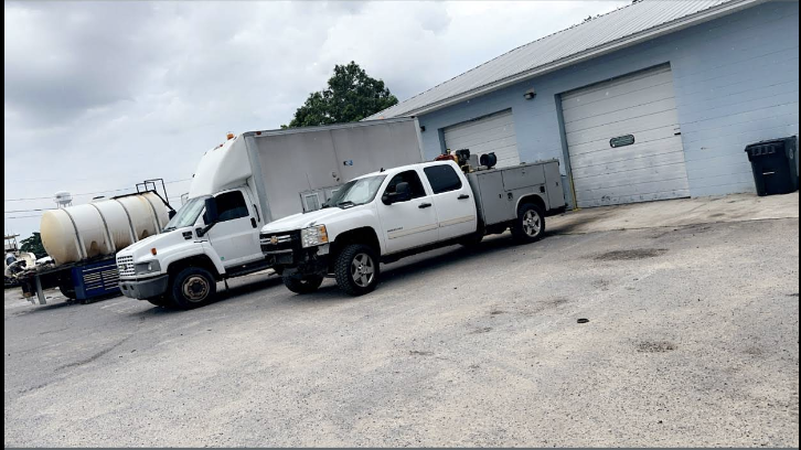 Service truck parked outside the shop