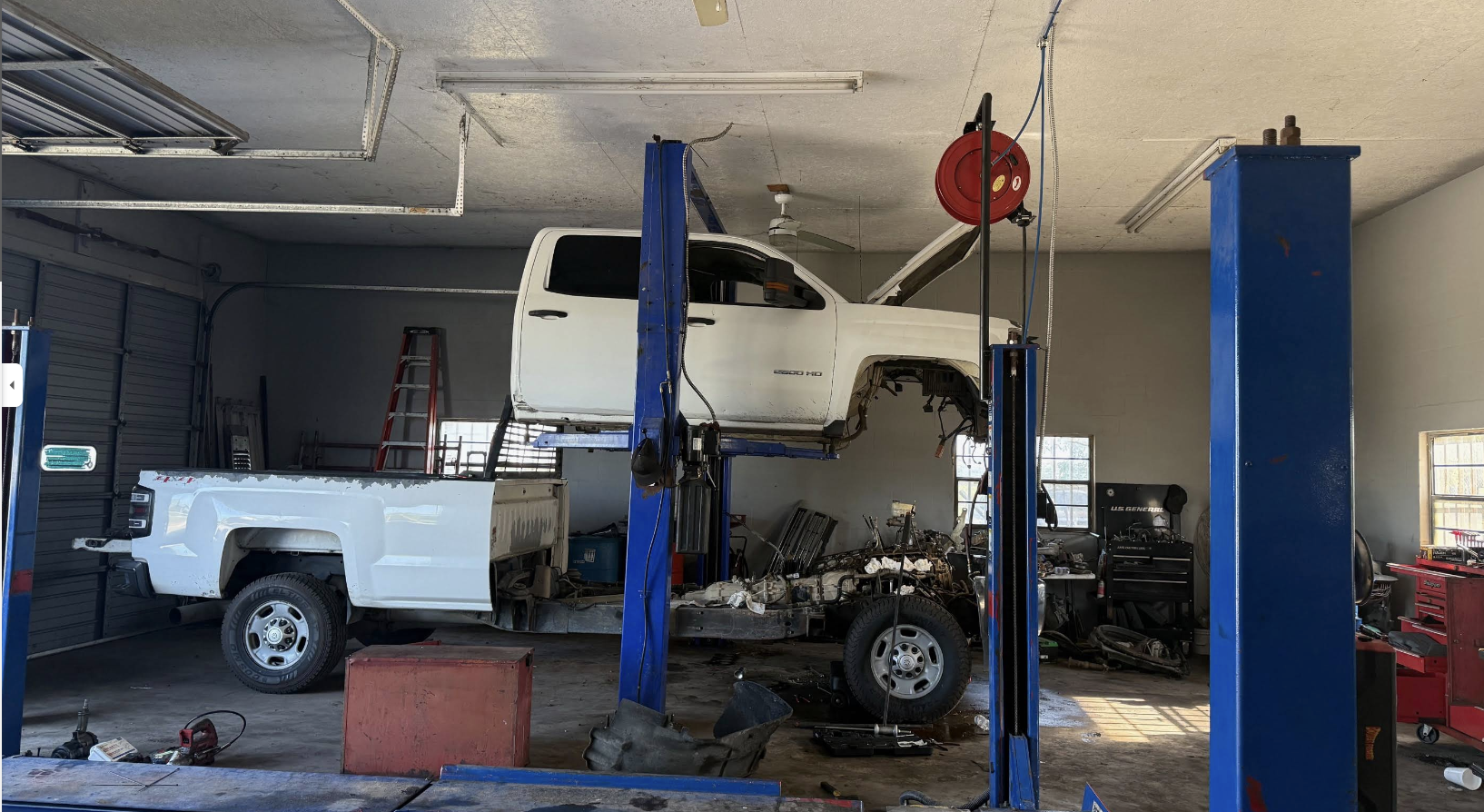 Truck on lift inside the shop