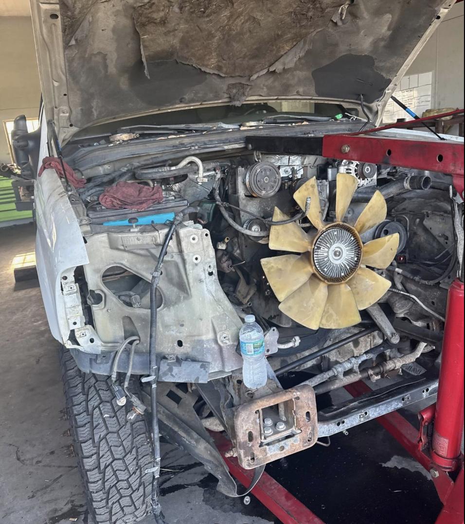 Engine bay repair work inside the shop
